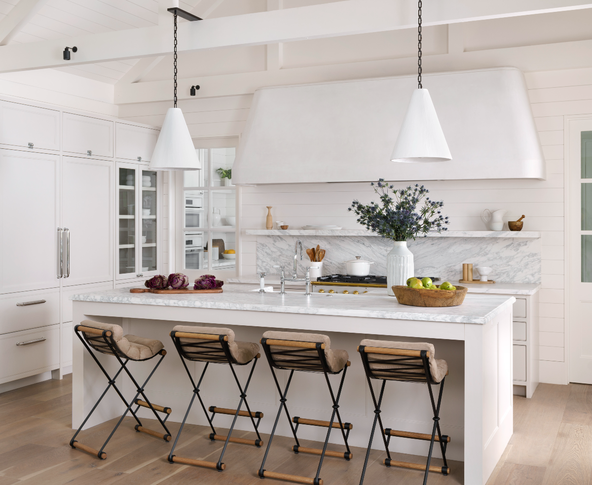 In a beautifully designed Austin, TX, kitchen, the large vent hood is finished in custom plaster by Sloan Montgomery.